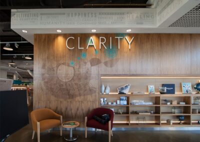 Custom paneling, signage, shelving, and built-in storage in a commercial storefront