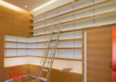 Custom Shelving and Paneling with Concealed Door